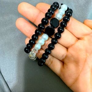 3 bracelet bundle (2 blacks 1 black and pearl/white/clear)
